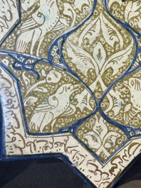An intact Kashan lustre-glazed star tile, Persia, 13/14th C.