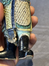 A fine Chinese verte biscuit figure of a warrior on wooden stand, Kangxi