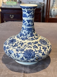 A Chinese blue and white 'lotus scroll' bottle vase, 18/19th C.