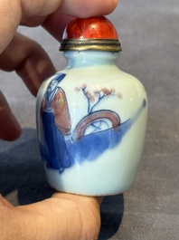 A Chinese blue, white and copper-red snuff bottle, 19th C.