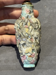 Eight Chinese moulded famille rose snuff bottles, Qianlong mark, 19th C.