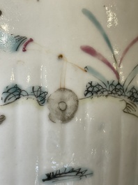 A pair of Chinese famille rose jars and covers with figures in a garden, Tongzhi mark and of the period