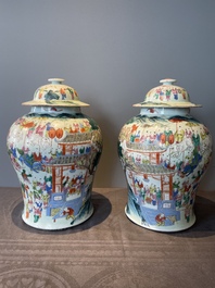 A pair of Chinese famille rose 'hundred boys' vases and covers on wooden stands, 19th C.