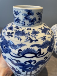 A Chinese blue and white garniture of five vases with lotus scrolls, 19th C.