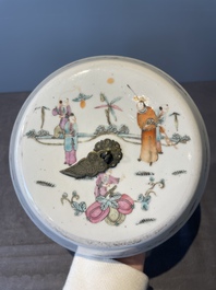 A pair of Chinese famille rose jars and covers with figures in a garden, Tongzhi mark and of the period