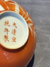 A Chinese coral-red-glazed bowl with reverse-decorated bamboo design, Xuantong mark and of the period