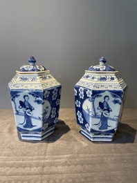 A pair of Chinese blue and white hexagonal jars and covers with a lady holding a fan, 19th C.