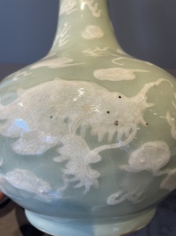 A Chinese celadon-ground slib design 'dragon' vase and Chinese blue and white vase or incense container, 19th C.