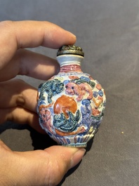 Six Chinese moulded famille rose snuff bottles, Qianlong mark, 19th C.