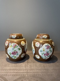 A pair of Chinese capucin-brown-ground famille rose covered jars with floral design, Yongzheng/Qianlong