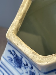 A pair of Chinese blue and white hexagonal jars and covers with a lady holding a fan, 19th C.