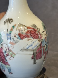 A pair of Chinese famille rose vases with figural design mounted as lamps, 19th C.