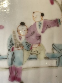 A pair of Chinese famille rose jars and covers with figures in a garden, Tongzhi mark and of the period