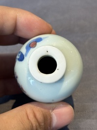 A Chinese blue, white and copper-red snuff bottle, 19th C.