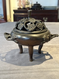 Two Chinese Chinese bronze cylindrical incense stick holders and a covered censer, Yuan/Ming and Qing