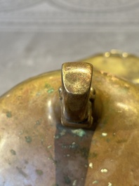 A Chinese bronze tripod censer with cover and stand, 19th C.