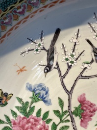 A Chinese famille verte and a famille rose dish with birds among blossom branches, 19th C.