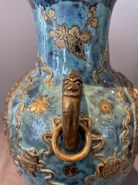 A pair of Chinese robin's egg and faux bronze-glazed 'hu' vases, Qianlong mark, 19th C.
