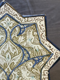 An intact Kashan lustre-glazed star tile, Persia, 13/14th C.