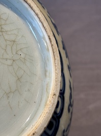 A Chinese blue and white 'lotus scroll' bottle vase, 18/19th C.