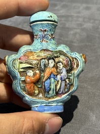 Eight Chinese moulded famille rose snuff bottles, Qianlong mark, 19th C.