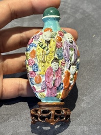 Eight Chinese moulded famille rose snuff bottles, Qianlong mark, 19th C.