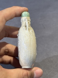 A rare Chinese monochrome ge-type 'chilong' snuff bottle with jadeite stopper, Qianlong mark and of the period