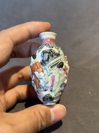 Six Chinese moulded famille rose snuff bottles, Qianlong mark, 19th C.