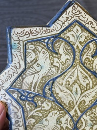 An intact Kashan lustre-glazed star tile, Persia, 13/14th C.