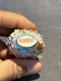 A Chinese famille rose moulded snuff bottle, Qianlong mark, late 18th/early 19th C.
