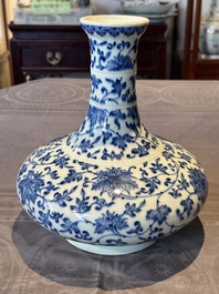 A Chinese blue and white 'lotus scroll' bottle vase, 18/19th C.