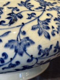 A Chinese blue and white 'lotus scroll' bottle vase, 18/19th C.