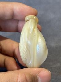 Two Chinese lacquered and mother-of-pearl-inlaid snuff bottles and a carved mother-of-pearl shell snuff bottle, Qianlong mark, 18/19th C