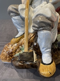 A Chinese polychrome sculpture of a lumberjack, Jingdezheng mark, 20th C.