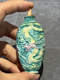 Eight Chinese moulded famille rose snuff bottles, Qianlong mark, 19th C.