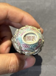 Eight Chinese moulded famille rose snuff bottles, Qianlong mark, 19th C.