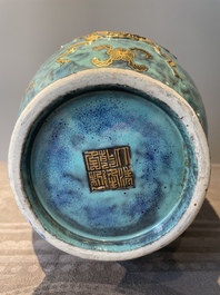A pair of Chinese robin's egg and faux bronze-glazed 'hu' vases, Qianlong mark, 19th C.