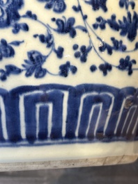 A Chinese blue and white 'flower scroll' jar with a wooden cover, Qianlong