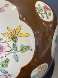 A pair of Chinese capucin-brown-ground famille rose covered jars with floral design, Yongzheng/Qianlong