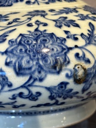 A Chinese blue and white 'lotus scroll' bottle vase, 18/19th C.