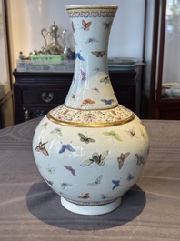 A Chinese famille rose 'butterfly' bottle vase, Guangxu mark and of the period