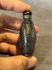 Two Chinese lacquered and mother-of-pearl-inlaid snuff bottles and a carved mother-of-pearl shell snuff bottle, Qianlong mark, 18/19th C