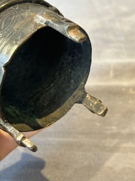 Two Chinese Chinese bronze cylindrical incense stick holders and a covered censer, Yuan/Ming and Qing