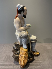 A Chinese polychrome sculpture of a lumberjack, Jingdezheng mark, 20th C.
