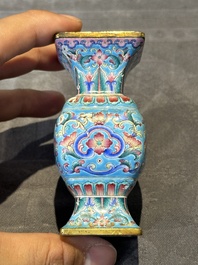 A Chinese Canton enamel 'gu' vase with floral design, Qianlong mark and of the period