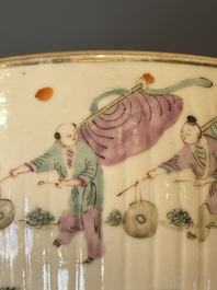 A pair of Chinese famille rose jars and covers with figures in a garden, Tongzhi mark and of the period