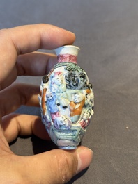 Six Chinese moulded famille rose snuff bottles, Qianlong mark, 19th C.