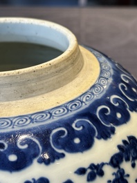 A Chinese blue and white 'flower scroll' jar with a wooden cover, Qianlong