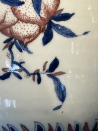 A Chinese blue, white and copper-red 'Three abundances' or 'Sanduo' vase, 19/20th C.