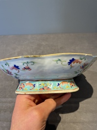 A Chinese blue, white and famille rose tea service, three famille rose bowls, a plate and a covered jar, 19th C.